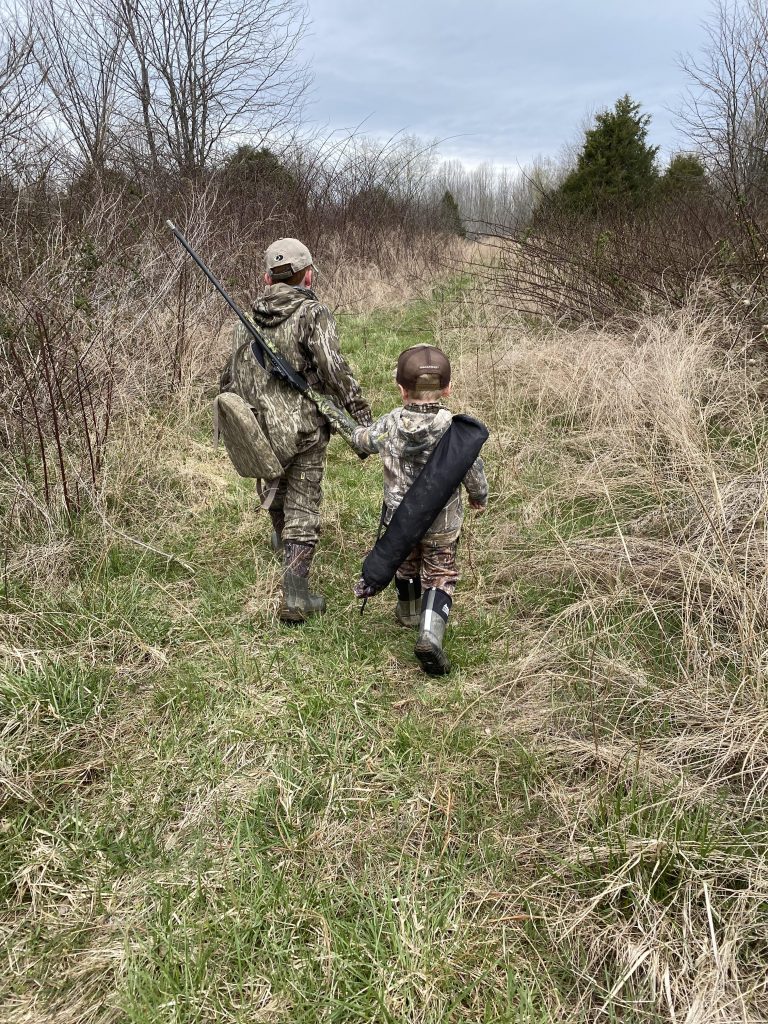 two youth hunters in the field