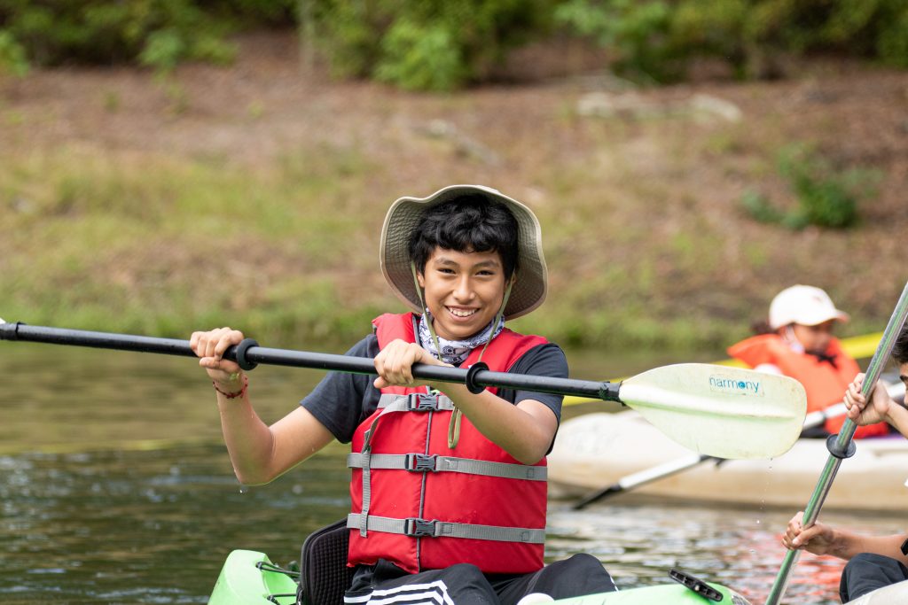 Young boy kayaking 