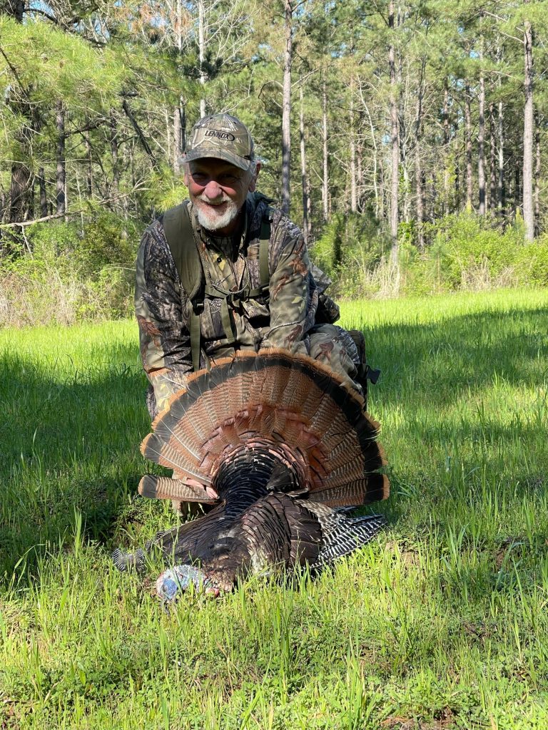 hunter with a harvested turkey