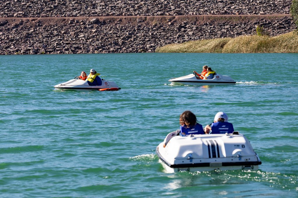 Students boat aroud the Cold Brook Reservoir