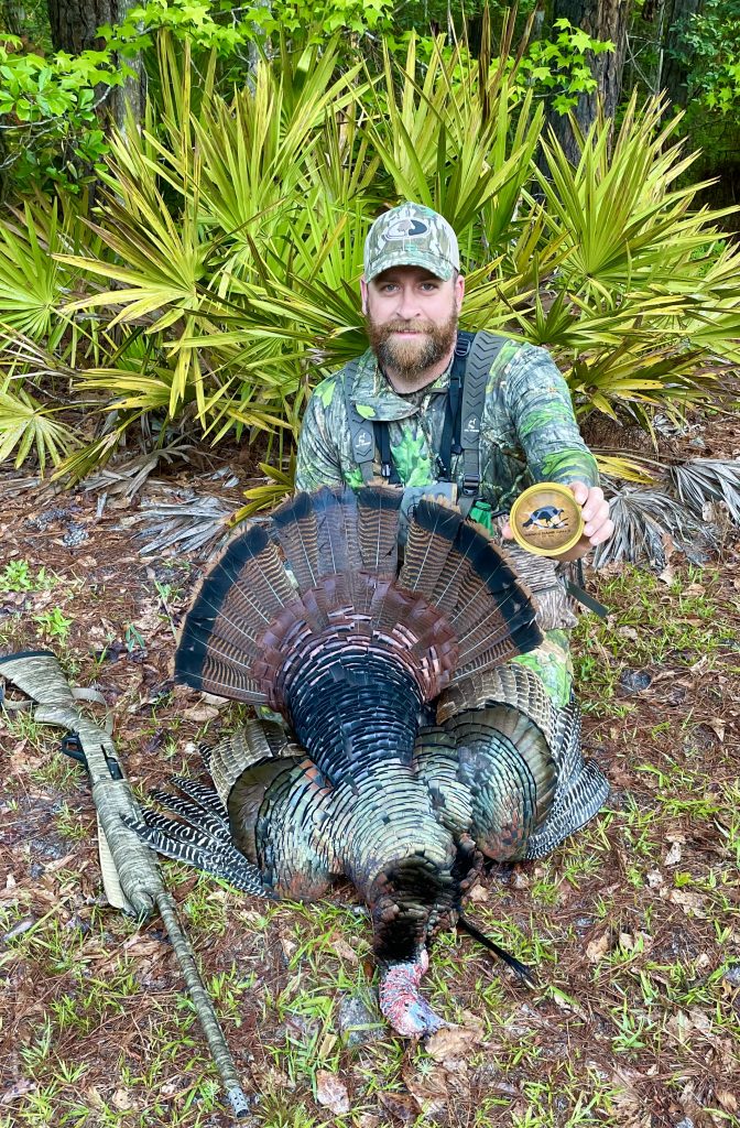 Dylan Bearden with a havested turkey. 