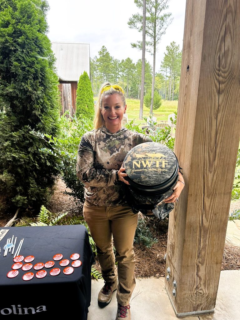 A hunter poses with a dove hunting stool.