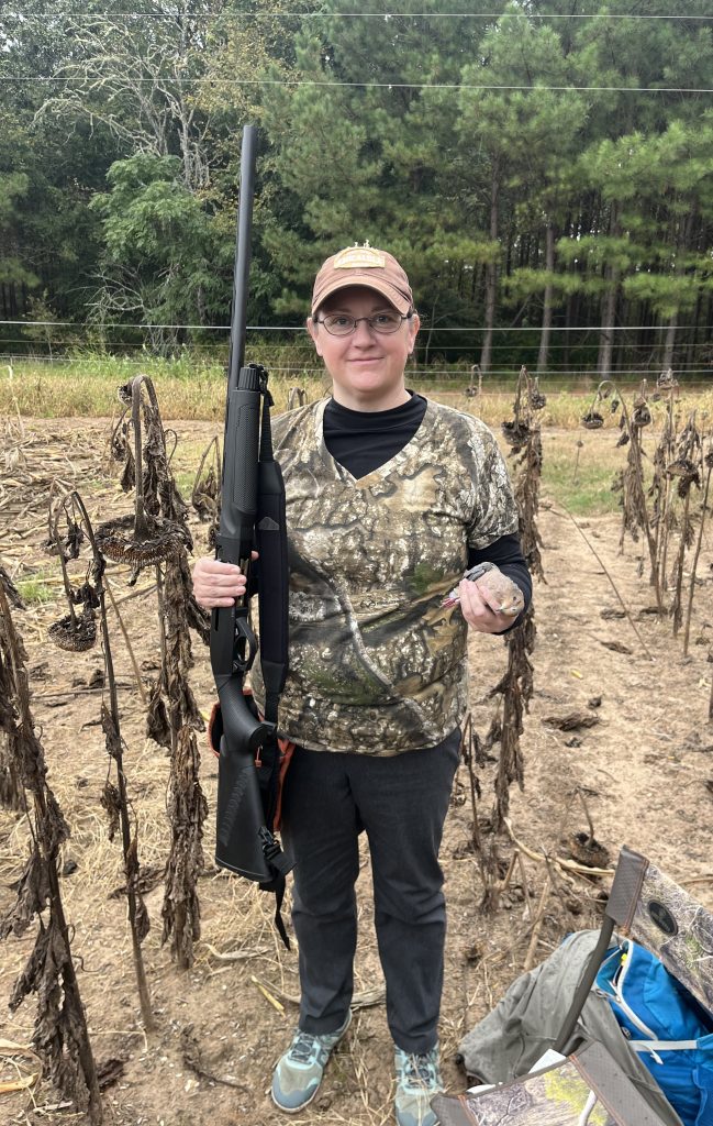 A hunter poses with her first harvested dove.