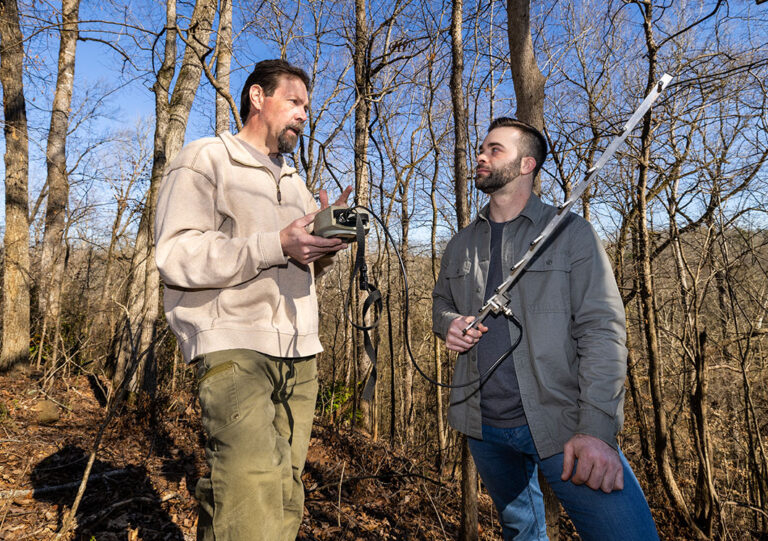 Warnell Professor Michael Chamberlain (left) and Ph.D. student Nickolas Gulotta use radio tracking equipment in Whitehall Forest. (Photo by Chamberlain Smith