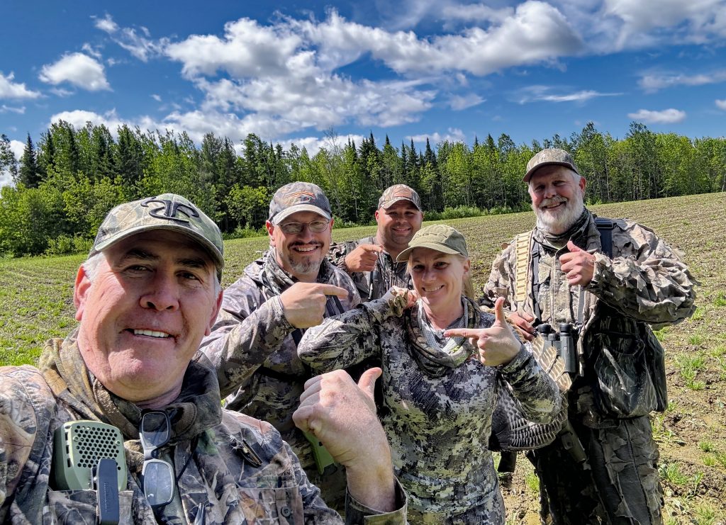 group of hunters posing after a turkey was harvested