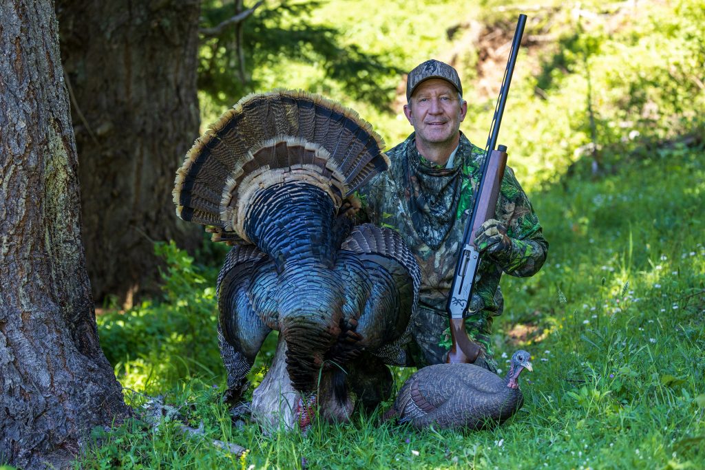 hunter posing with his harvested turkey