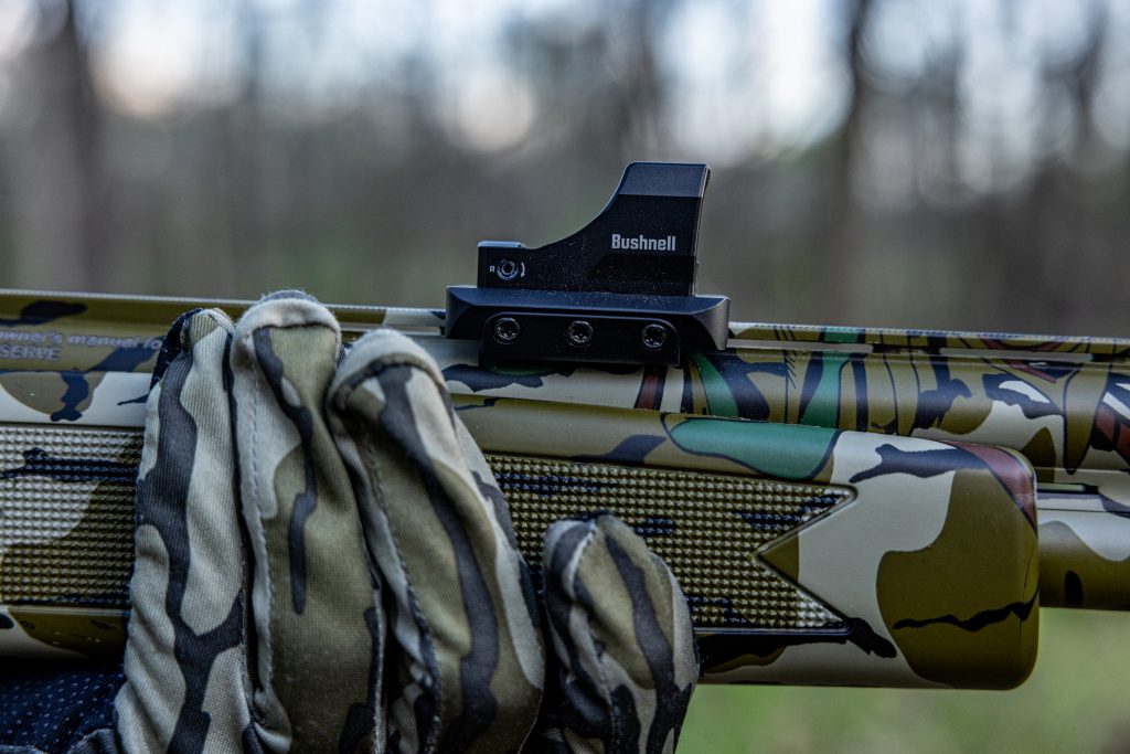 A close up of how the Warne mount works on a shotgun.