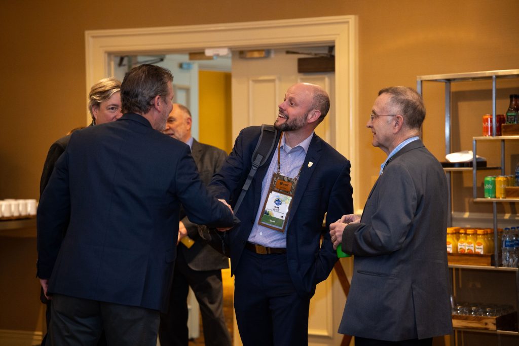 NWTF co-CEO Kurt Dyroff shakes hands with partners.