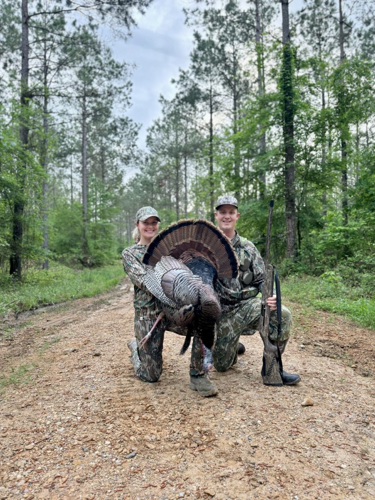 Tanna and her husband drew celebrate the harvest of a rare-banded wild turkey
