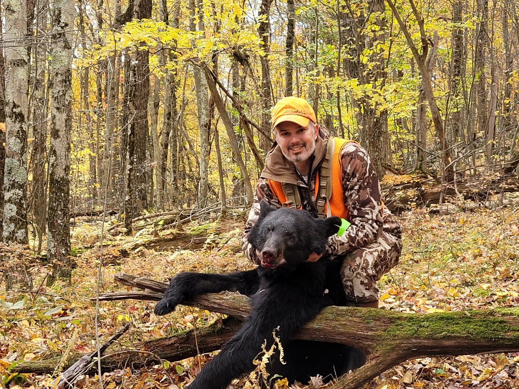 Blake with harvested black bear