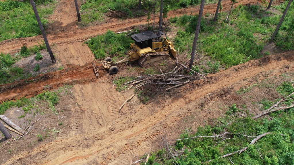 An aerial shot of a dozer creating firebreaks.