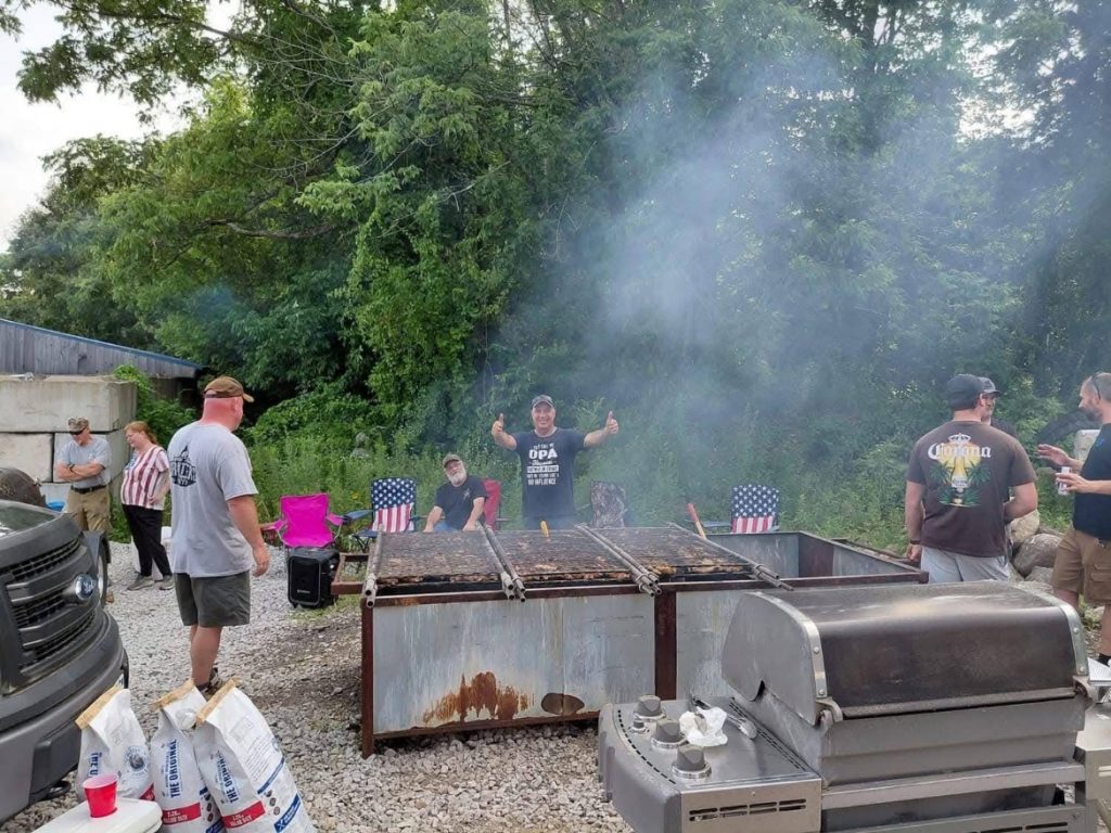 Volunteers all take turns running the fire pit