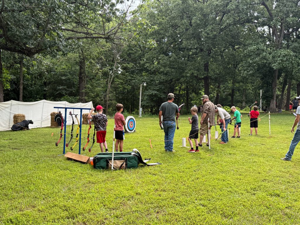 Youth practice archery.