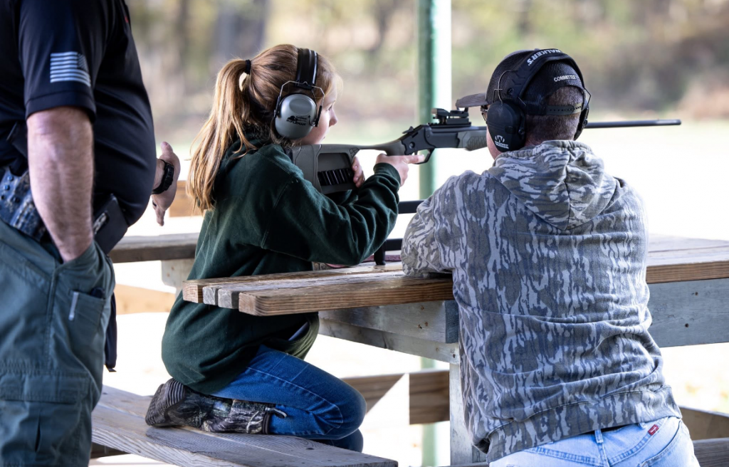 Young girl shots at gun range.