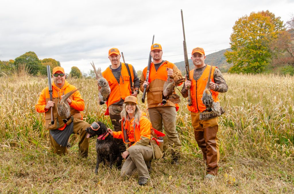 A group of attendees after a successful pheasant harvest.