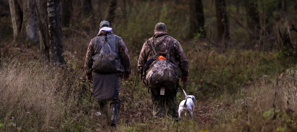 hunters walking in the woods